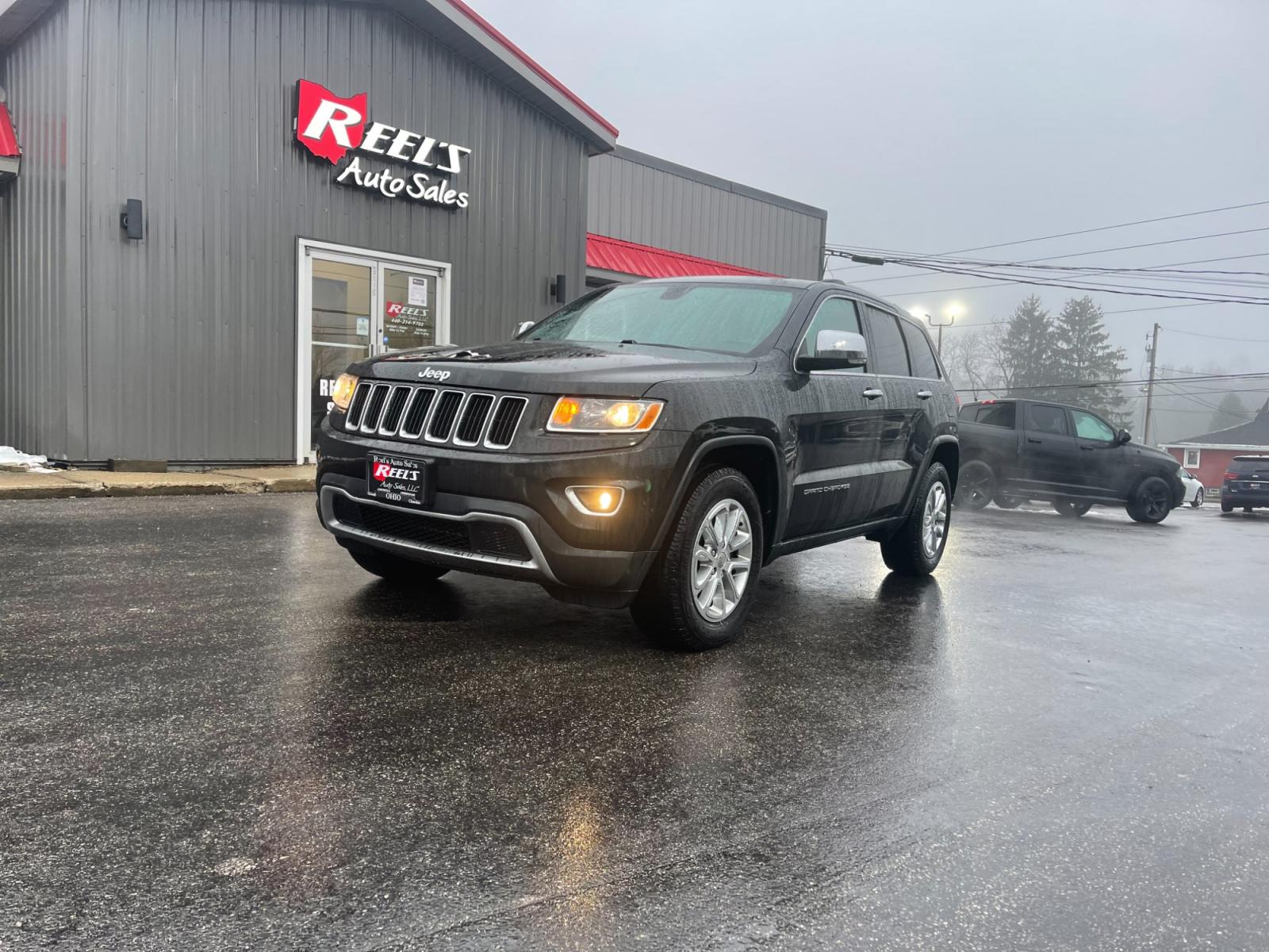 2015 Black /Black Jeep Grand Cherokee Limited 4WD (1C4RJFBG2FC) with an 3.6L V6 DOHC 24V FFV engine, 8-Speed Automatic transmission, located at 547 E. Main St., Orwell, OH, 44076, (440) 437-5893, 41.535435, -80.847855 - This 2015 Jeep Grand Cherokee Limited 4WD comes equipped with a 3.6L Pentastar V6 engine paired with an 8-speed automatic transmission, offering a blend of power and efficiency. It boasts a luxurious leather interior with both front and rear heated seats for comfort in various climates. For convenie - Photo #0